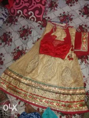 Long red n cold lehenga in m size