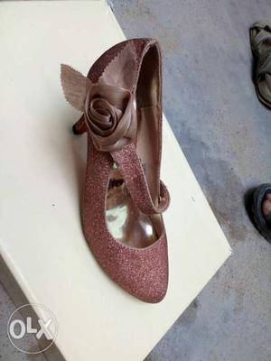 Pair Of Beige Flower-accent Shoes