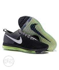 Pair Of Black-and-green Nike Zoom Shoes