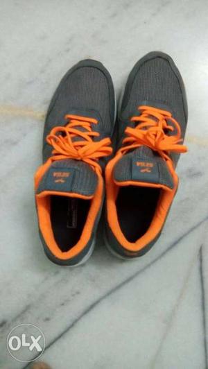 Pair Of Black-and-orange Nike Running Shoes