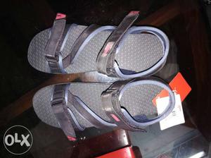 Pair Of Gray-and-red Sandals