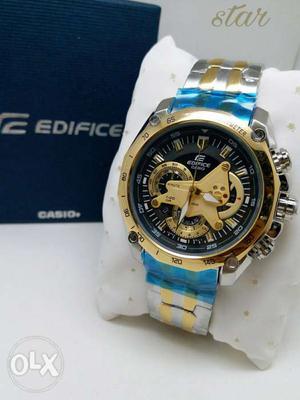 Round Gold Invicta Chronograph Watch With Blue Strap