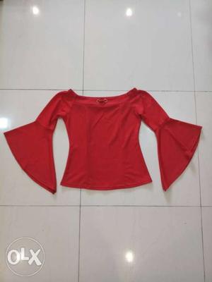 This is a cute off shoulder red top with bell