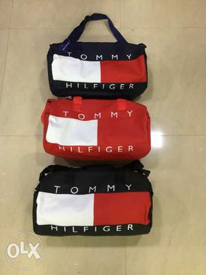 Three Black-red-and-white Tommy Hilfiger Duffel Bags