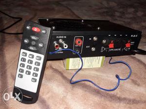 Black Corded Electronic Device With Remote Control