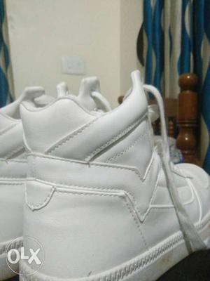 Pair Of White High-top Basketball Shoes