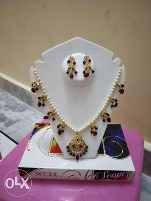 Red Jeweled Gold-colored Necklace And Pair Of Earrings