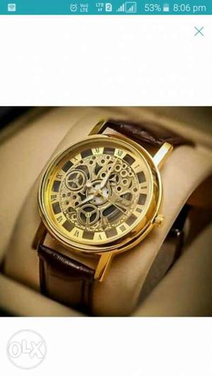 Round Gold-colored Skeleton Watch With Brown Leather Strap
