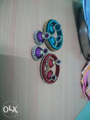 Three Blue, Maroon, And Purple Jhumka Earrings
