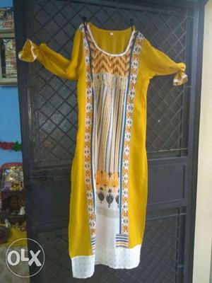 Yellow multiple prints kurti only serious buyer
