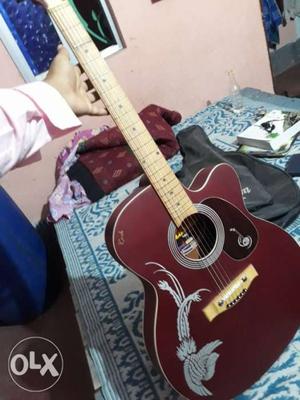 Maroon And White Acoustic Guitar