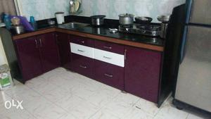 Maroon And White Wooden Kitchen Cupboards