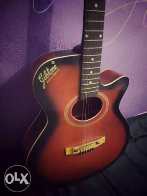 Red And Black Gibtone Acoustic Guitar with a free tuner and