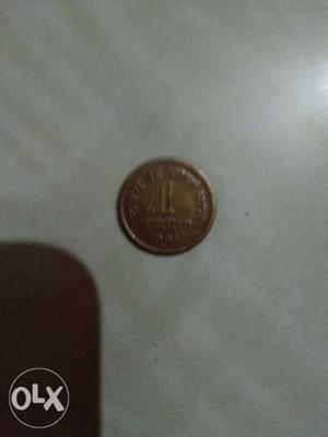 Round Copper-colored 1 Indian Coin