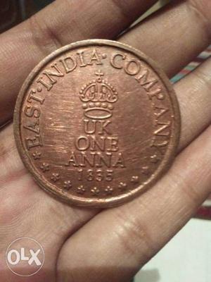 Round  Gold-colored 1 U.K. Anna Coin