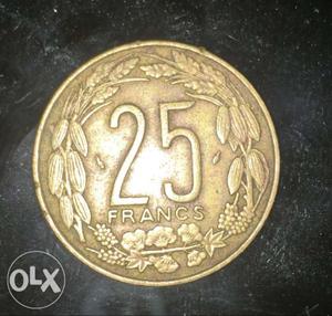 Round Gold-colored 25 Francs Coin