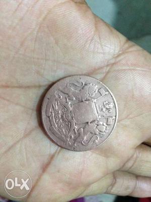 Round Silver-colored Coin