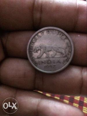 Round Silver-colored Indian Coin