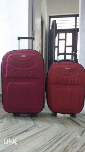 Two Red Trolley Luggages