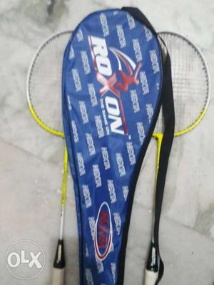 Two White-and-yellow Roxon Badminton Rackets