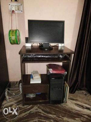 Black Flat Screen computer With Black Wooden table