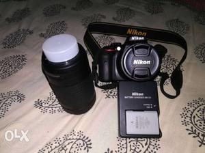 Black Nikon DSLR Camera With dual Lens
