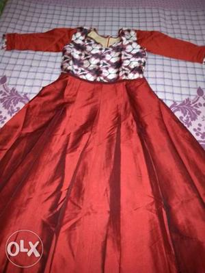 Dark maroon gown...small in size..