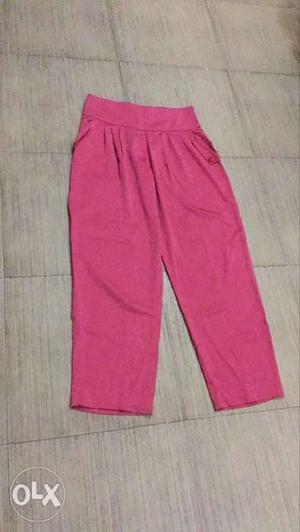 Lush pink pants with a medium size in saturn