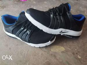 Pair Of Black-and-white Adidas Running Shoes