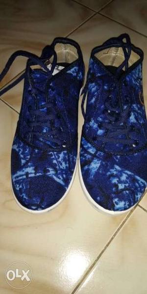 Pair Of Blue Mid-top Shoes