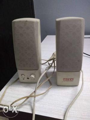 Two White Intex Multimedia Speakers