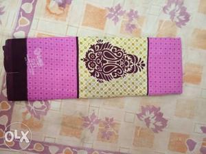 White, Pink, And Purple Floral Textile