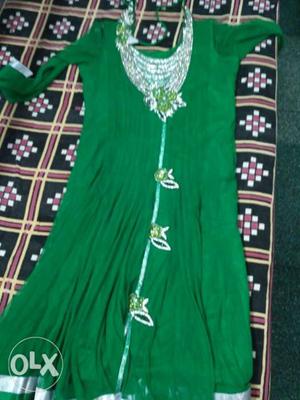 2 time used dark green colour frock suit