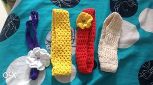 Baby's Four Purple, Yellow, Red, And White Crochet Headbands