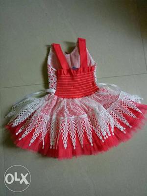 Red colour net material..size 16..for 1 year to 2