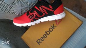 Unpaired Red And Black Reebok Running Shoe With Box