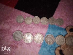 6 silver coins of half rupes and 6 silver coins of 1 rs. 100
