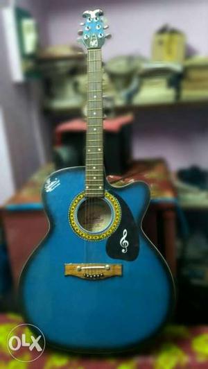 One week old brand new acoustic guitar interested