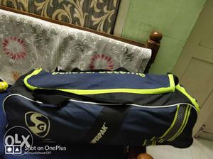 SG cricket kitbag with wk pads gloves. batting pads gloves &