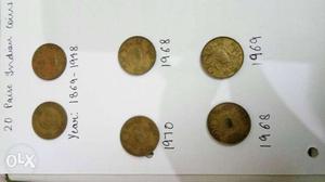Six Round Bronze-colored Coins