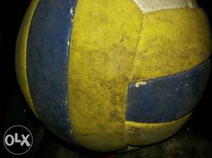 Yellow, White, And Blue Volleyball