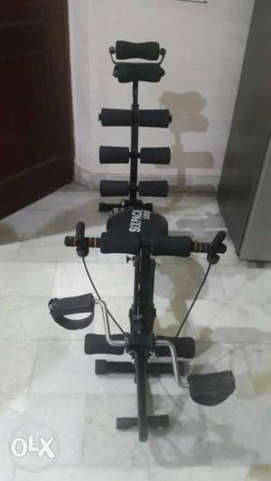 An unused exerciser for back, abs and knees