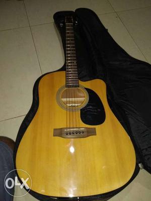 Brown Acoustic Guitar With Black Case