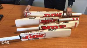 Four White-and-red MRF Wooden Cricket Bats