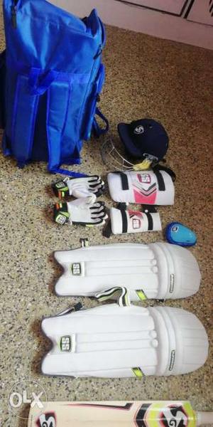 Pair Of White Shin Guards And Gloves