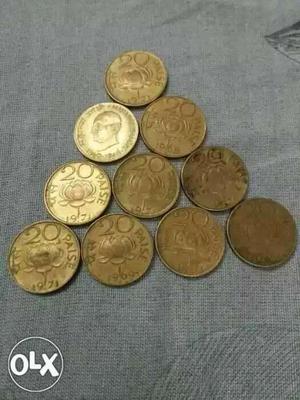 Ten Gold-colored 20 Indian Paise Coins