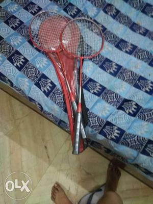 Two Red-and-black Badminton Rackets With Case