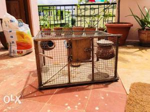 Bird cage capacity of holding 6 birds and 2 and food navane
