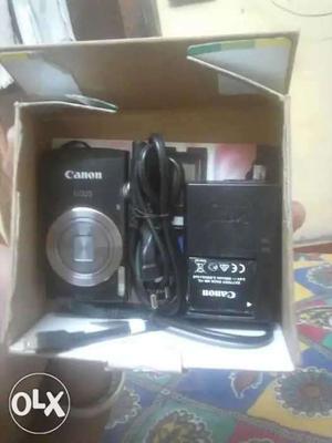 Black Canon IXUS Point-and-shoot Camera With Charger And Box