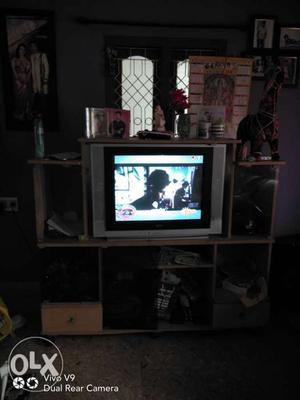 Black Flat Screen TV With Brown Wooden Entertainment Center